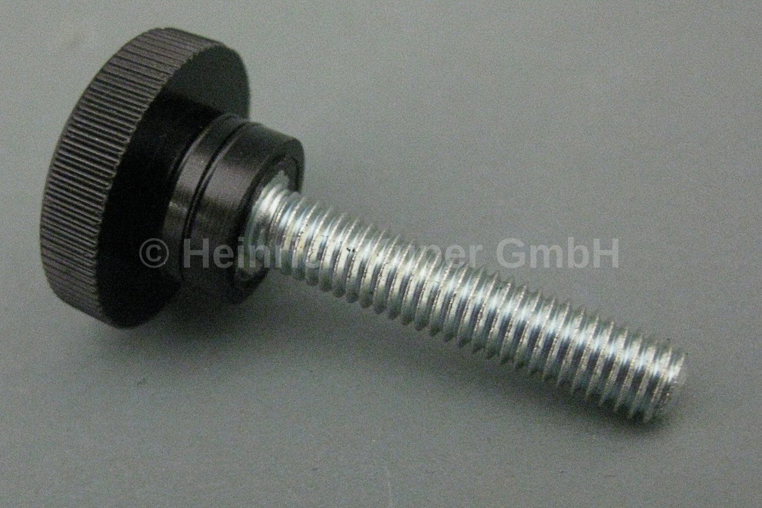 Rändelschraube M6x30mm, 22 mm Durchmesser mit Stahlgewindestift M 6/30 mm vorstehend aus Preßstoff Type 31 schwarz